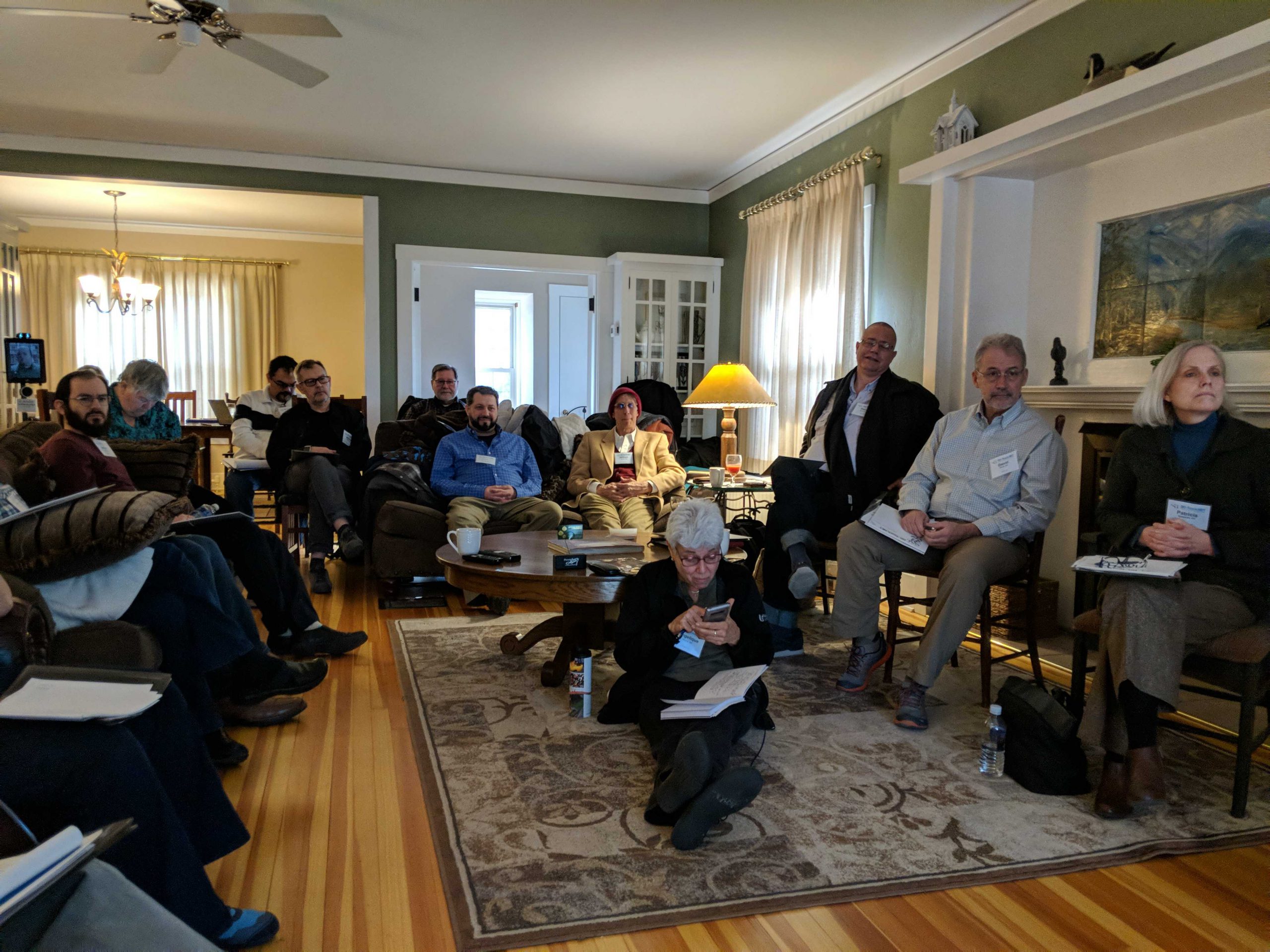 A room with people watching a presentation.